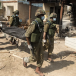 Soldiers remove civilian in KFAR AZA, ISRAEL