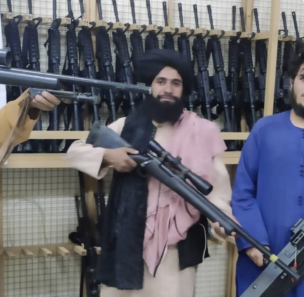 Taliban fighters display US Weapons in Afganistan