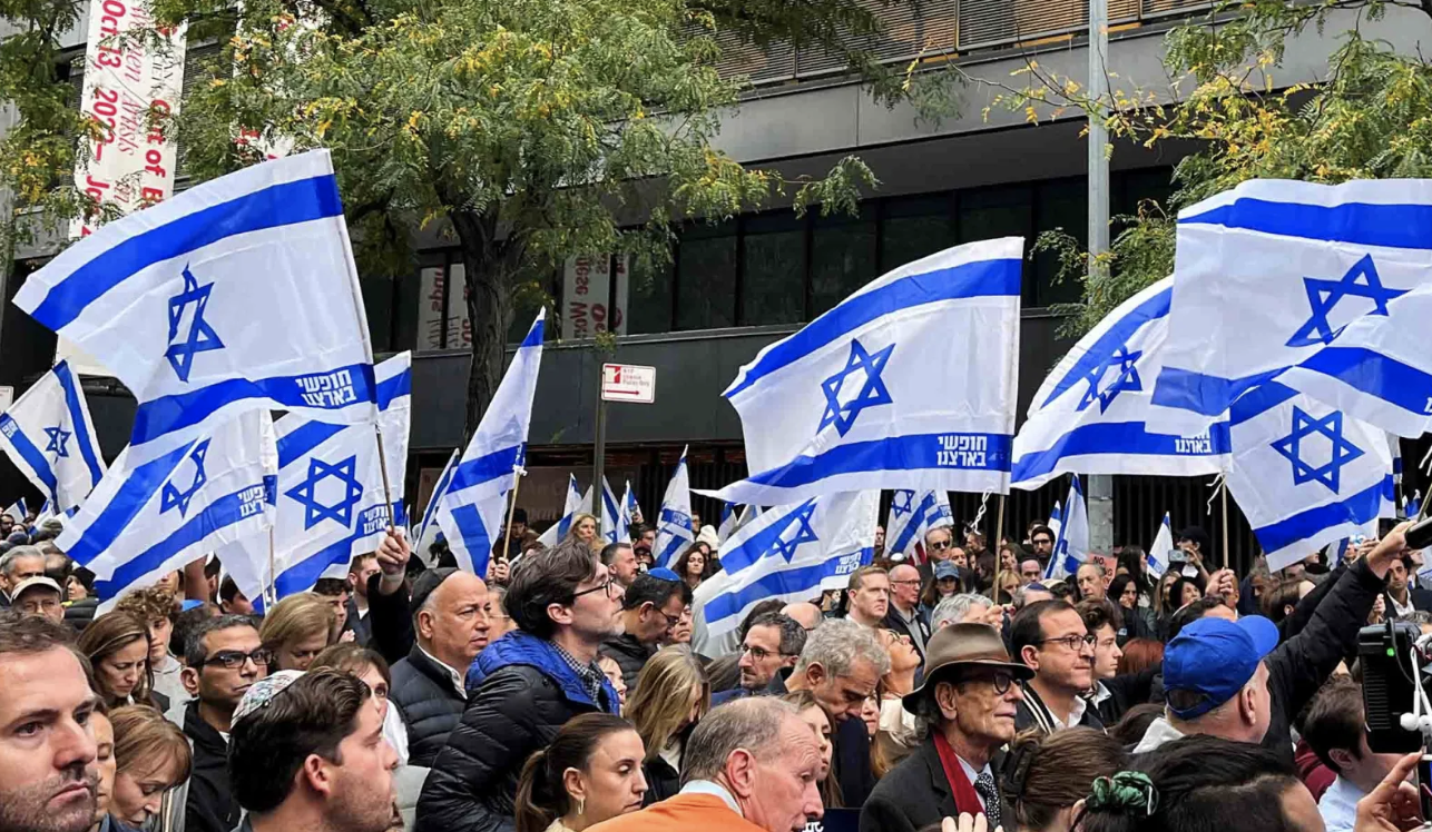 sea of Israeli flags at New York Stands with Israel” rally in New York