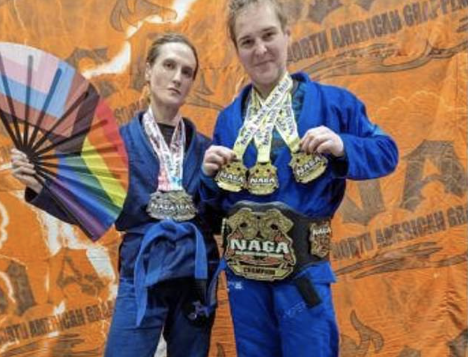 2 transgender male athletes show meadals won as women