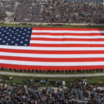 giant US flag on football field