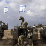 Israeli tanks with Israeli flags