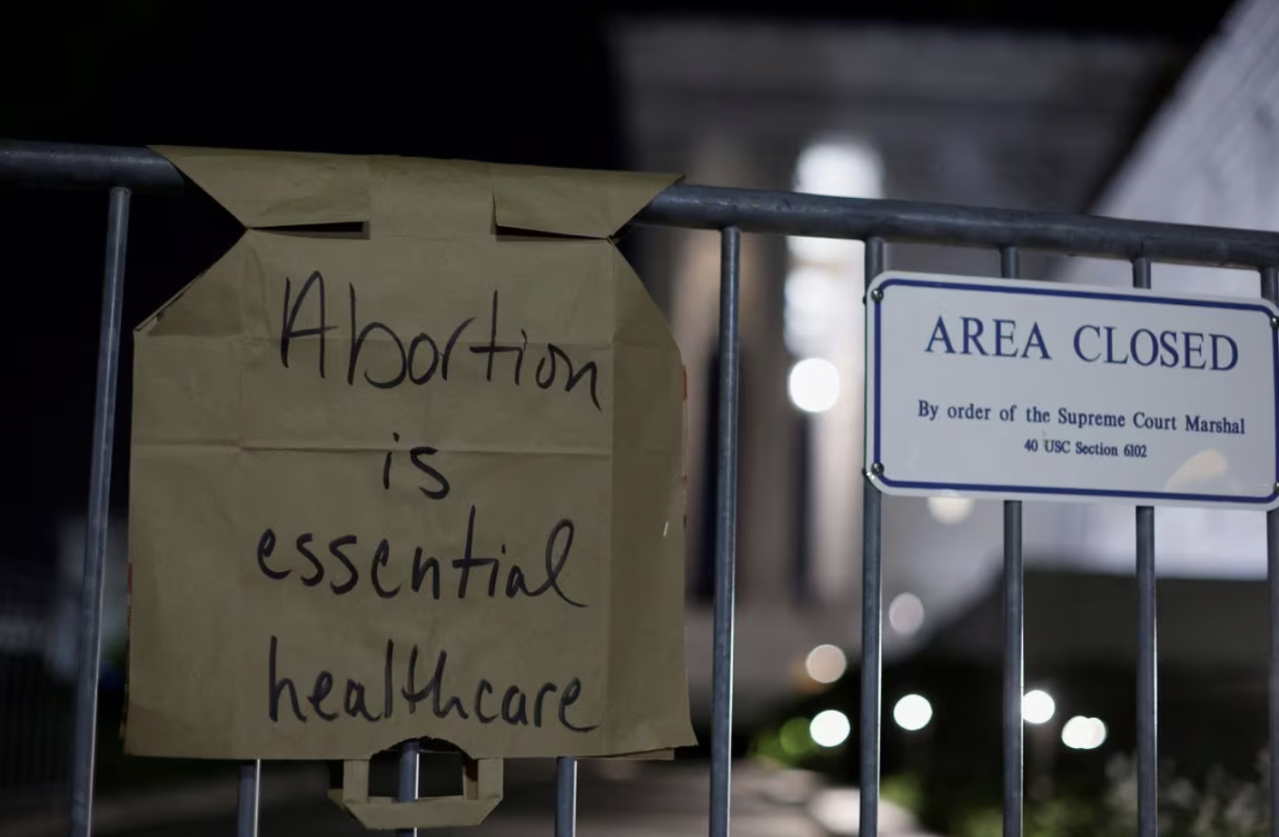 Paper handwritten sign - Abortion is essential healthcare