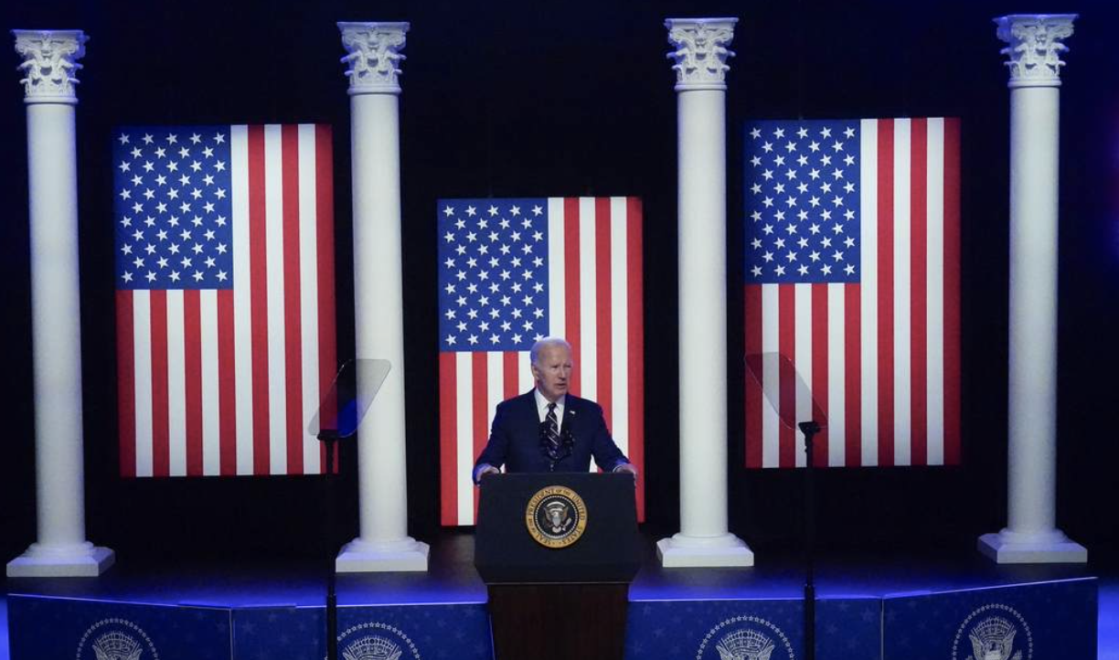 Biden campaigning 3 us flags