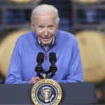 Sheepish Biden behind presidential podium