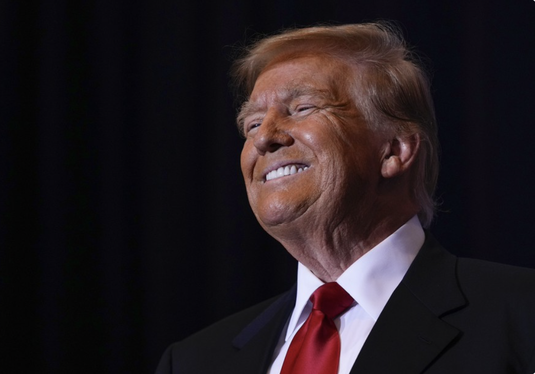Trump - huge grin side view