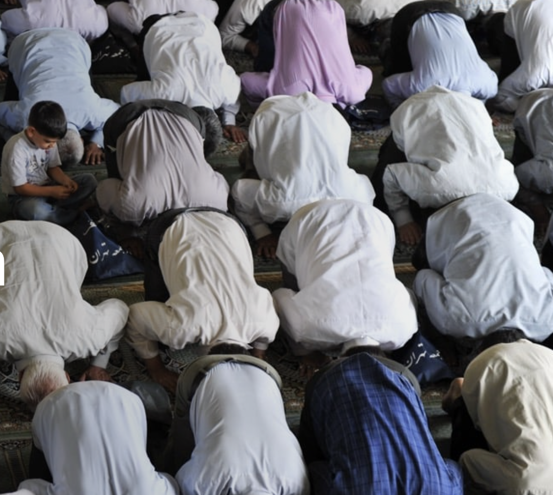 muslim men praying - small boy