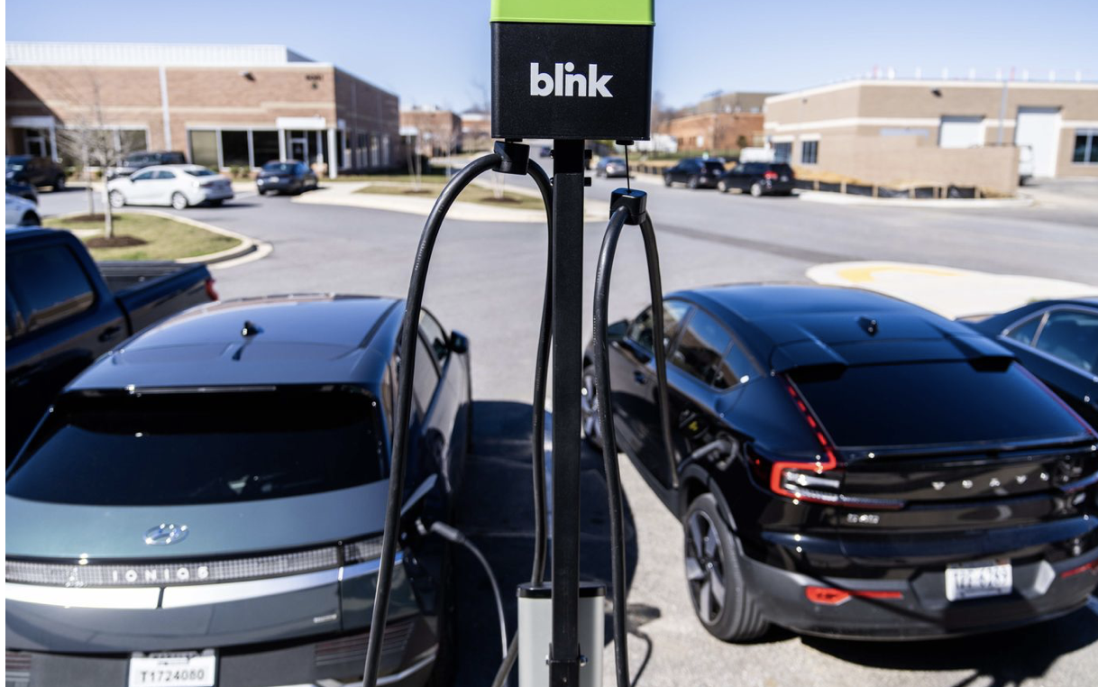 two cars recharge at Blink Charging station