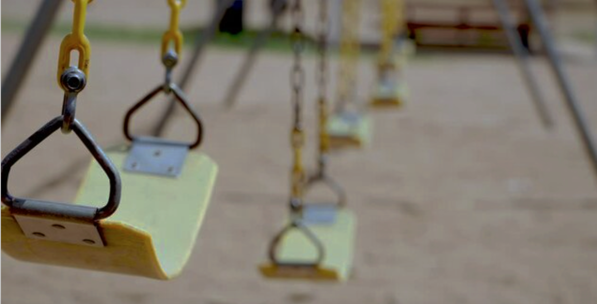 Empty swing set - no children - darkened