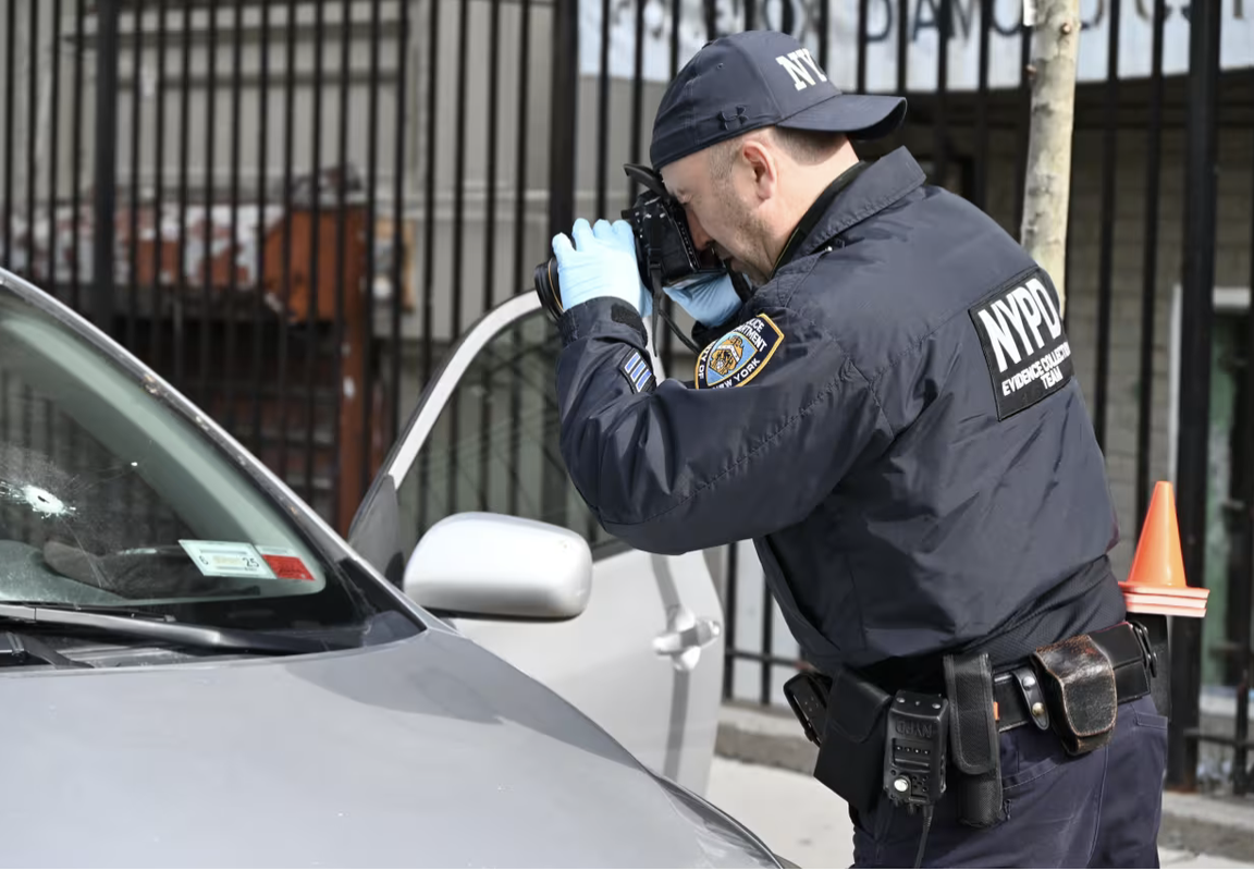 NYPD cop gathers evidence - Manhattan