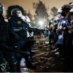 line of riot gear police vs line of pro-hamas students