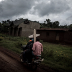 Believers on a motorcycle in Dem Rep of Congo