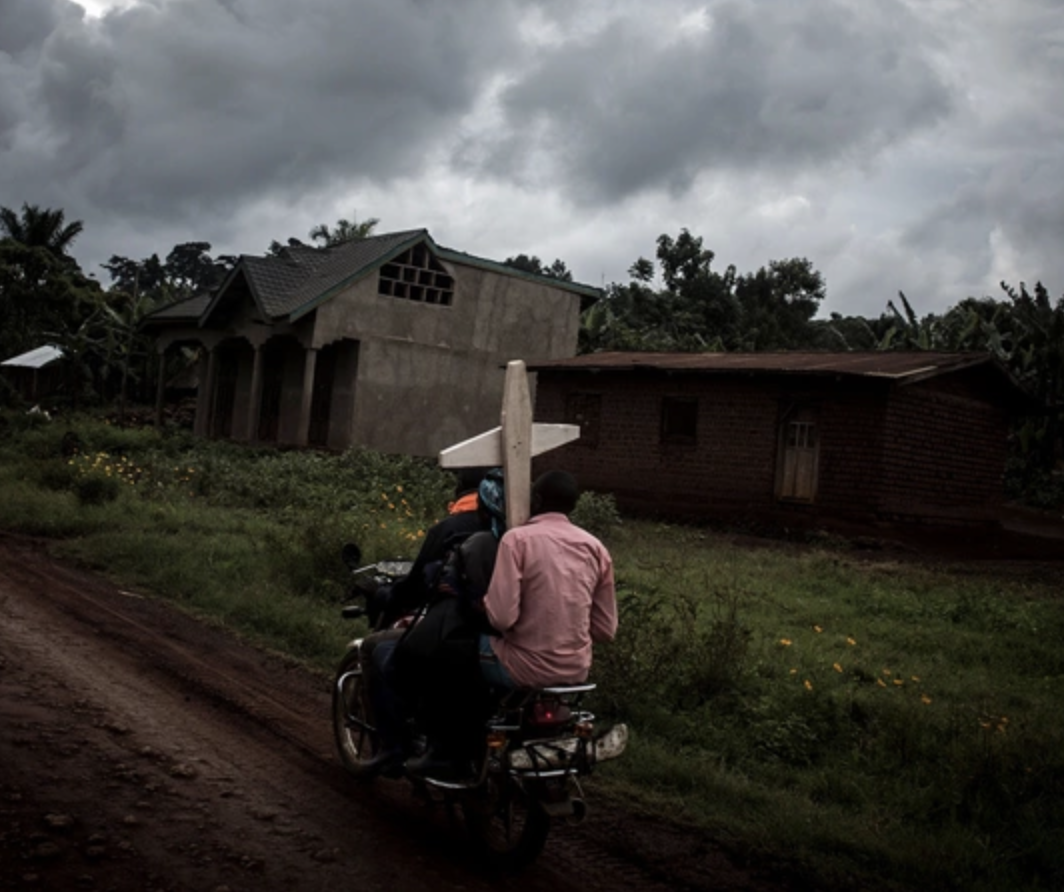 Believers on a motorcycle in Dem Rep of Congo