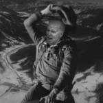 B&W of cowboy Biden riding a missile up