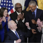 Biden seated - Obama others applaud