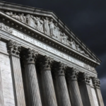 Supreme Court Building in dark stormy skies