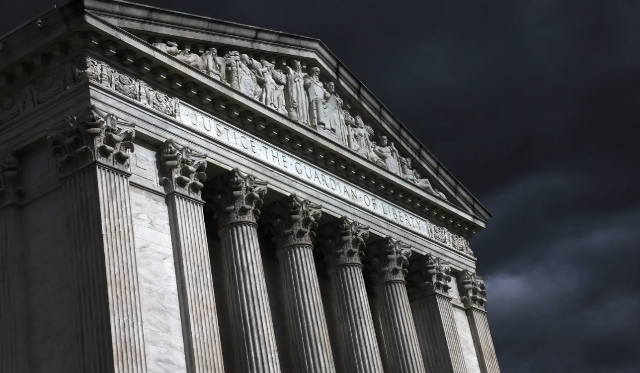 Supreme Court Building in dark stormy skies