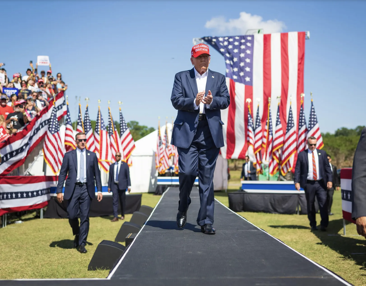 Trump walks to platform for campaign speech