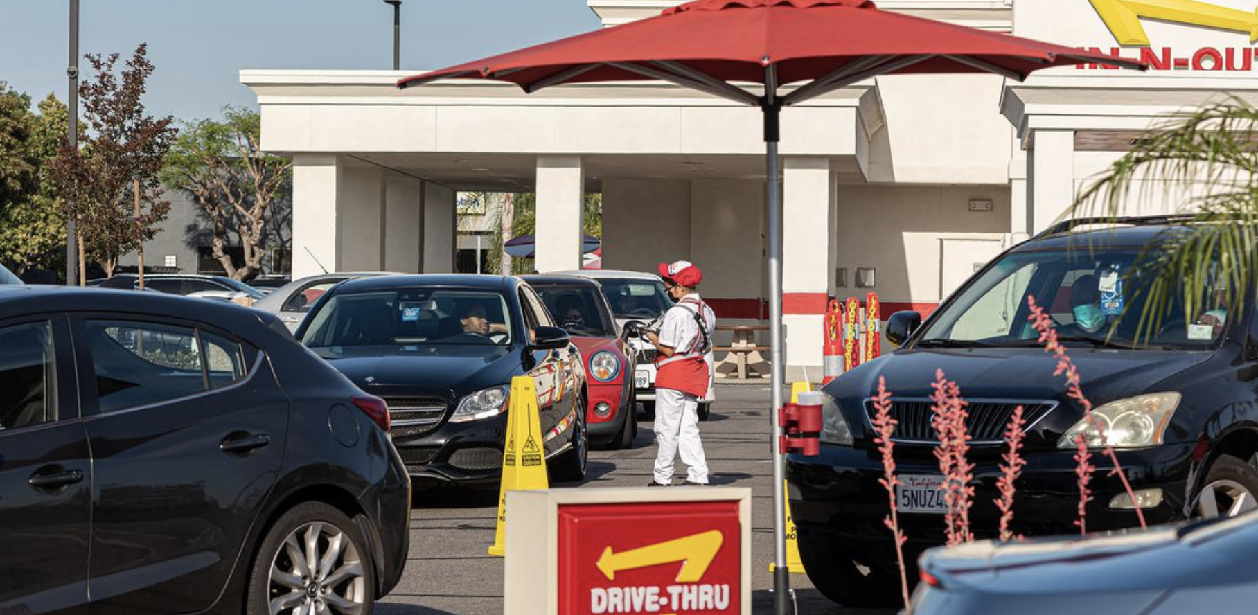 worker in a restaurant fast food drive through