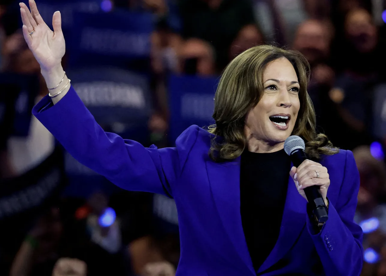 Kamala smiles and waves from the campaign trail