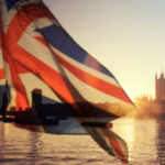 London across the Thames through a British flag