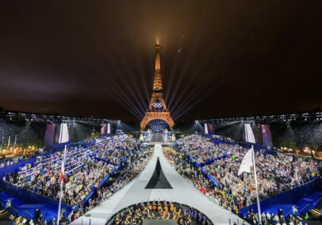 Olympics stadium with Eiffel tower in the back