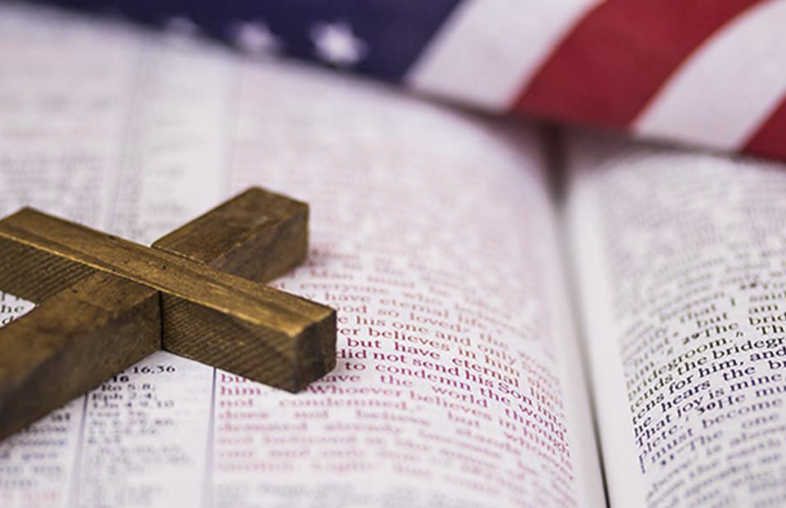 Open Bible, US Flag, wooden Cross