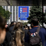 People wait in line to register for the DNC