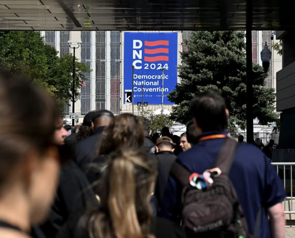 People wait in line to register for the DNC