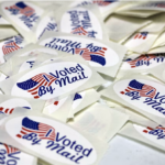 Pile of I voted by mail stickers