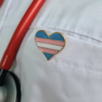 med-student with transgender heart pin