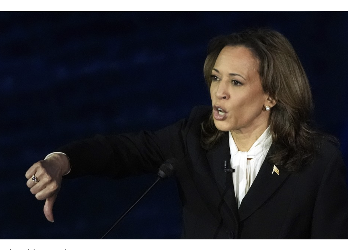 Kamala Harris in black gives thumbs down