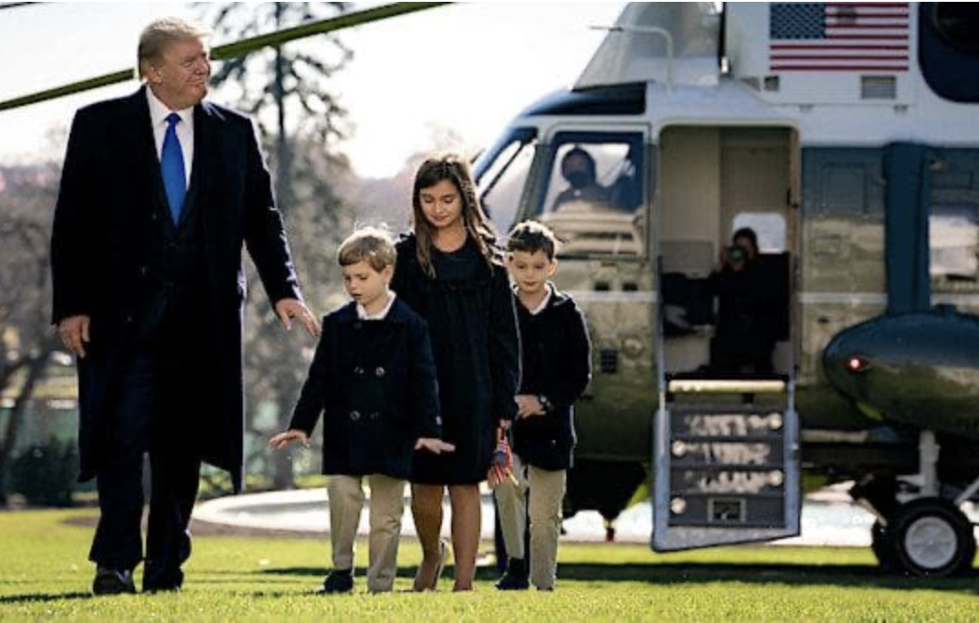 Donald Trump with grandchildren and Presidential helicopter