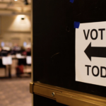 Vote here sign at voting place in a church