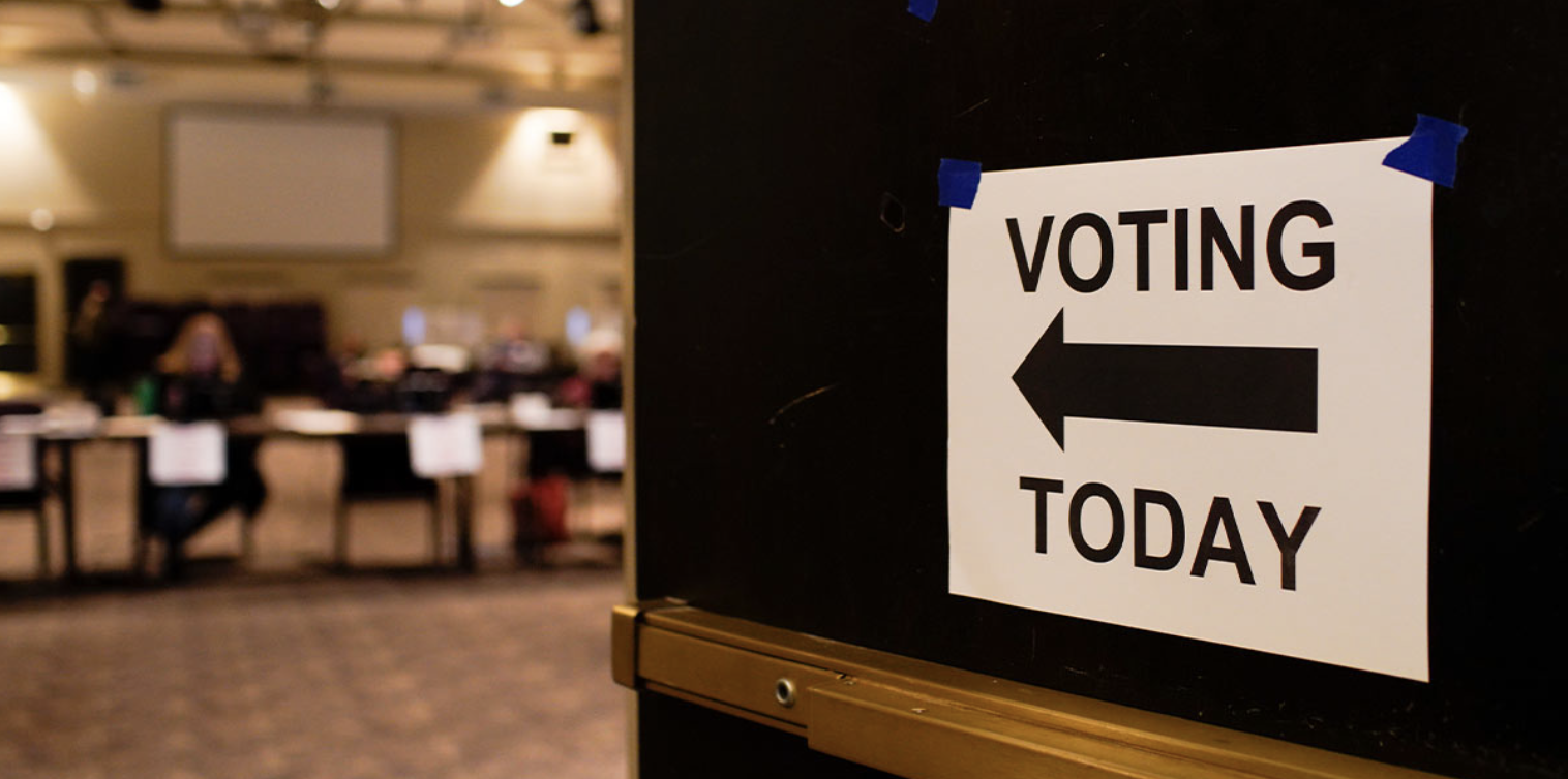 Vote here sign at voting place in a church