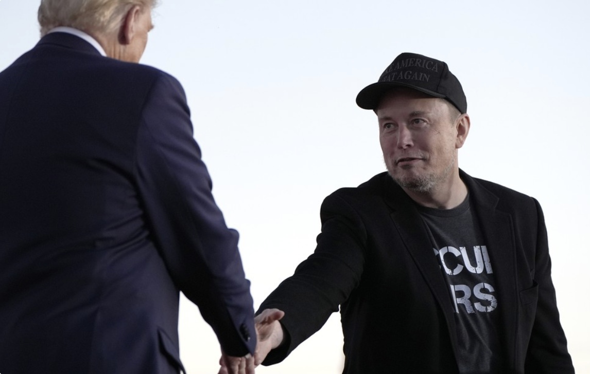 Trump and Musk shake hands