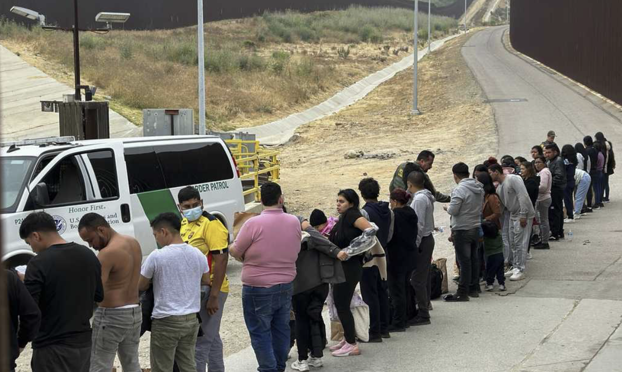 line of illegal immigrants caught by border patrol