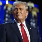 smiling Trump on election stage