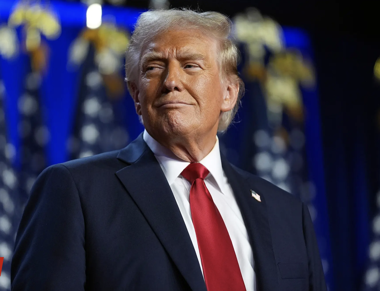 smiling Trump on election stage