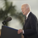 Biden at podium with rainy palm trees