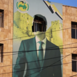 Damaged poster of Syrian president Bashar al-Assad in Aleppo, Syria