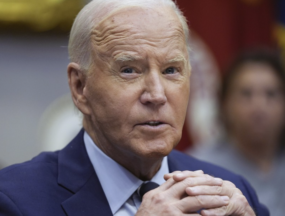 Joe Biden fingers locked raised eyebrow