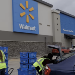 WalMart employees load groceries for pick-up into customer cars