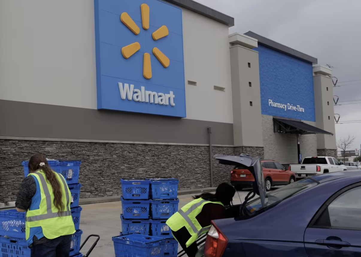 WalMart employees load groceries for pick-up into customer cars