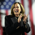 campaigning Kamala claps applauds smiles