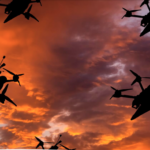 four large drones against stormy twilight sky