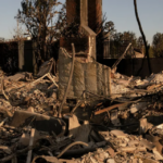 CA homeowners stand amid their homes ashes