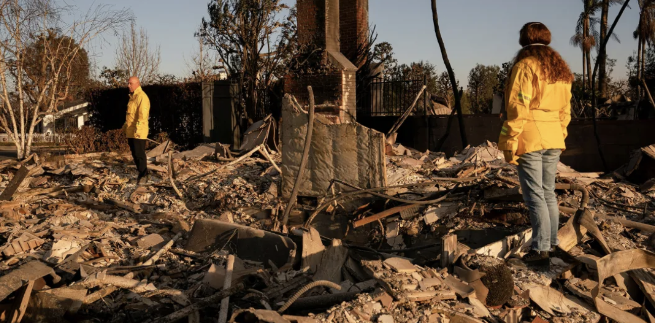 CA homeowners stand amid their homes ashes