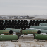 Pipes for the Keystone XL pipeline stacked in a yard near Oyen, Alberta, Canada