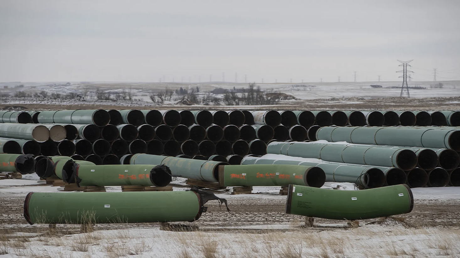 Pipes for the Keystone XL pipeline stacked in a yard near Oyen, Alberta, Canada